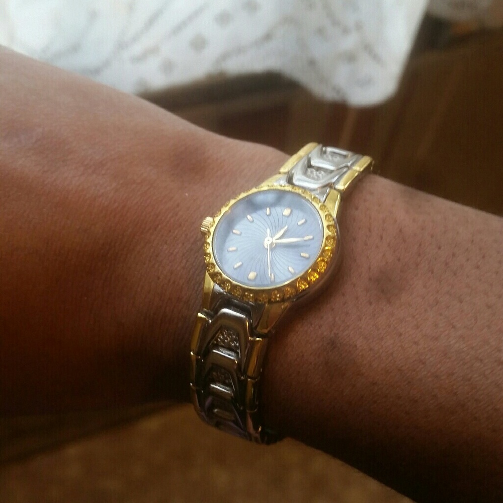 GOLD AND BLACK GENEVA WATCH